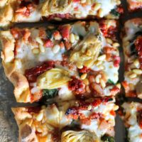 Prosciutto, Artichoke Heart, and Sun-Dried Tomato Pizza with Pine Nuts and Spinach | theroastedroot.net #glutenfree #pizza @bobsredmill @roastedroot