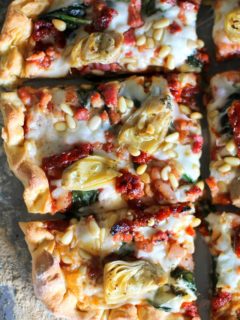 Prosciutto, Artichoke Heart, and Sun-Dried Tomato Pizza with Pine Nuts and Spinach | theroastedroot.net #glutenfree #pizza @bobsredmill @roastedroot