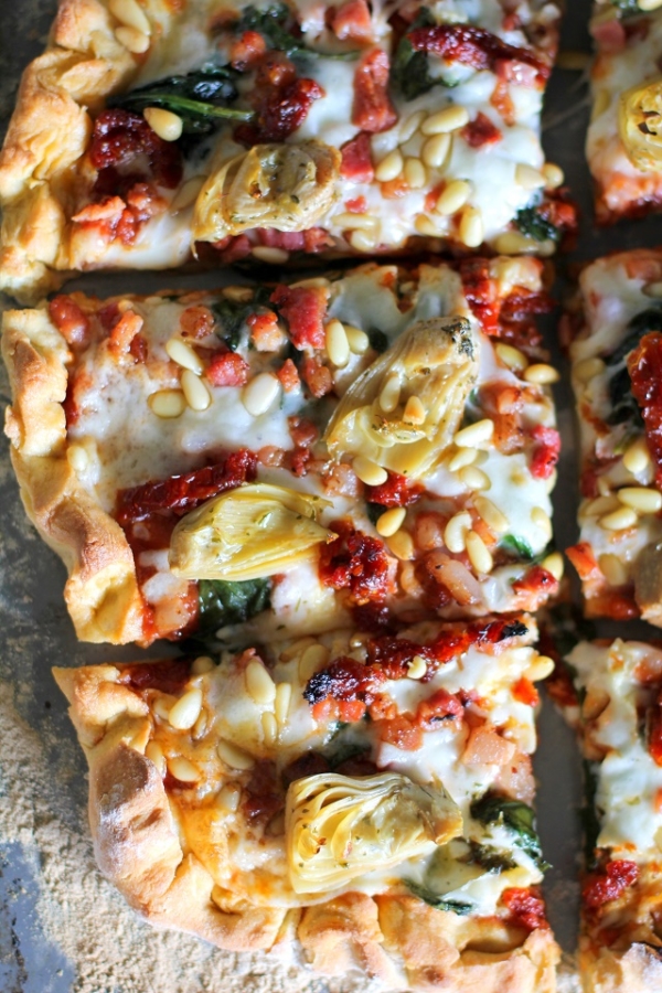 Prosciutto, Artichoke Heart, and Sun-Dried Tomato Pizza with Pine Nuts and Spinach | theroastedroot.net #glutenfree #pizza @bobsredmill @roastedroot
