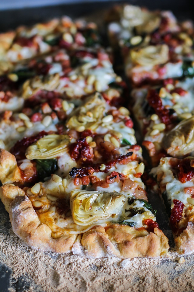 Prosciutto, Artichoke Heart, and Sun-Dried Tomato Pizza with Pine Nuts and Spinach | theroastedroot.net #glutenfree #pizza @bobsredmill @roastedroot