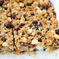 Cranberry White Chocolate Macadamia Nut Granola Bars | theroastedroot.net Healthy granola bars made with rolled oats and honey @bobsredmill @roastedroot