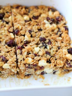 Cranberry White Chocolate Macadamia Nut Granola Bars | theroastedroot.net Healthy granola bars made with rolled oats and honey @bobsredmill @roastedroot