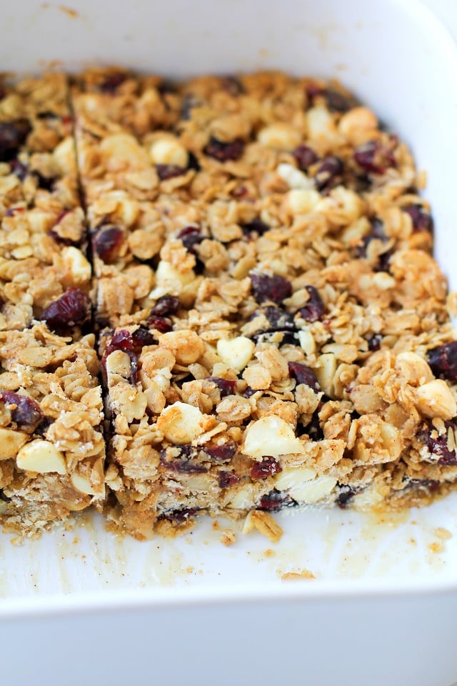 Cranberry White Chocolate Macadamia Nut Granola Bars | theroastedroot.net Healthy granola bars made with rolled oats and honey @bobsredmill @roastedroot