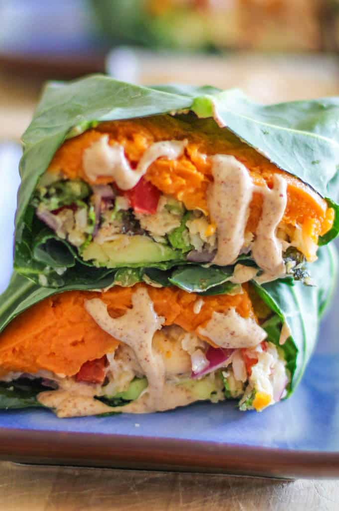 Collard Wraps with roasted mashed sweet potatoes, Thai cauliflower rice, avocado, and almond butter ginger dressing - a healthy plant-based vegan lunch recipeq