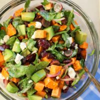 Roasted Sweet Potato Salad with Spinach, Grapes, Dried Cranberries, and Avocado | theroastedroot.net