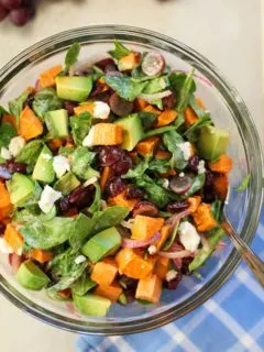 Roasted Sweet Potato Salad with Spinach, Grapes, Dried Cranberries, and Avocado | theroastedroot.net