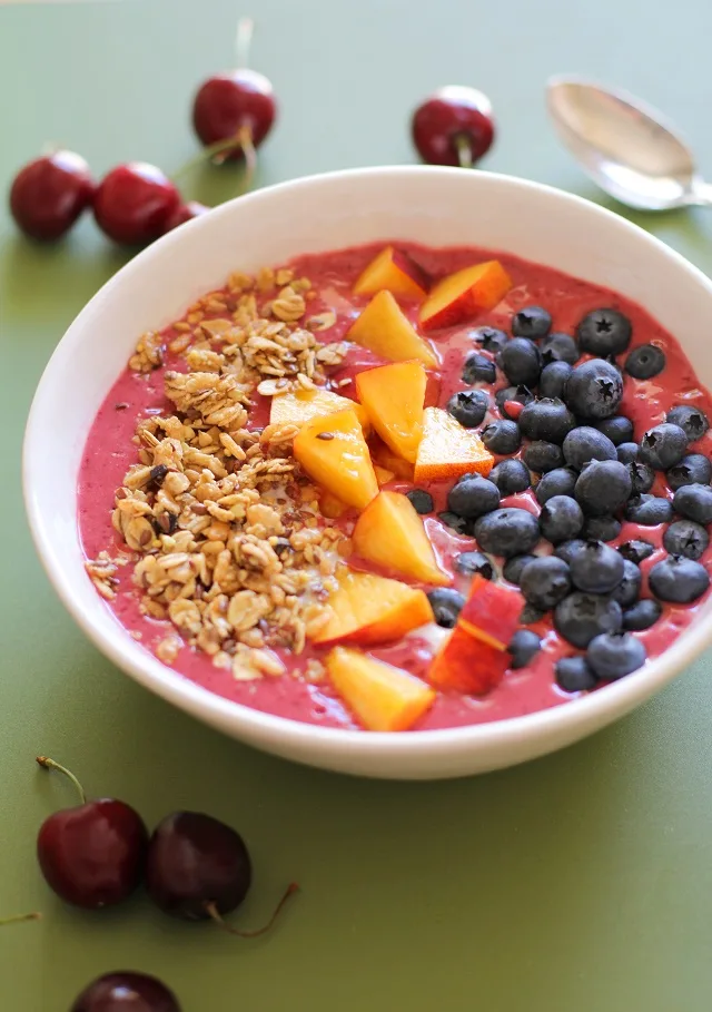 Cherry Coconut Smoothie Bowls with peaches, blueberries, and granola - a healthy vegan and paleo-friendly breakfast | theroastedroot.net #brunch #healthy #recipe