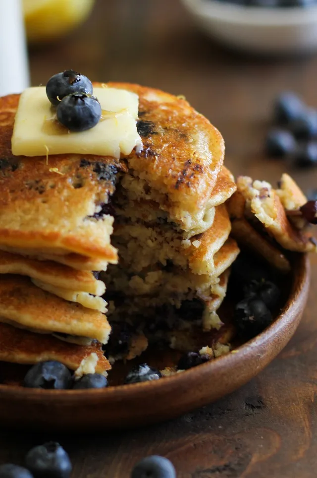 Gluten Free Lemon Blueberry Protein Pancakes made with almond flour + a secret ingredient | TheRoastedRoot.net #healthy #breakfast #recipe
