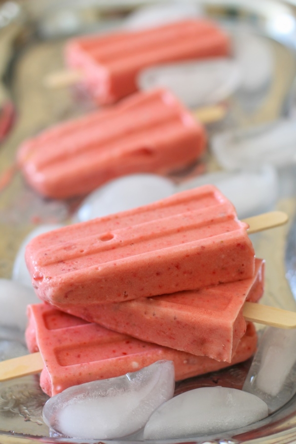 Strawberry Coconut Milk Popsicles - naturally sweetened, dairy-free, vegan, and paleo! #dessert #recipe TheRoastedRoot.net