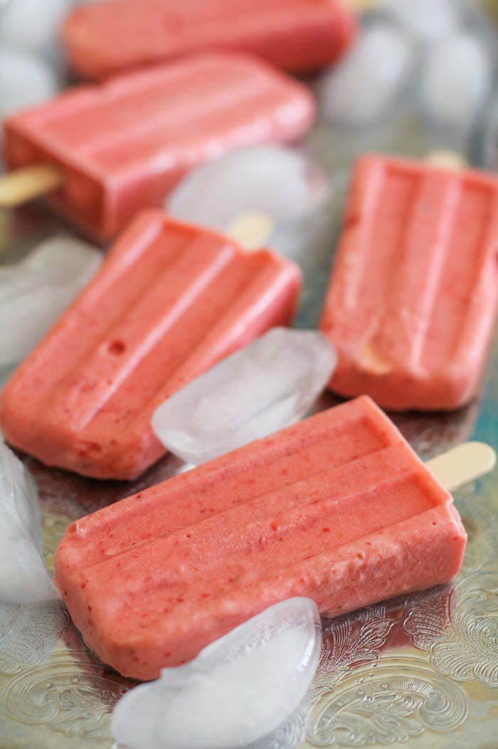 Strawberry Coconut Milk Popsicles - naturally sweetened, dairy-free, vegan, and paleo! #dessert #recipe TheRoastedRoot.net