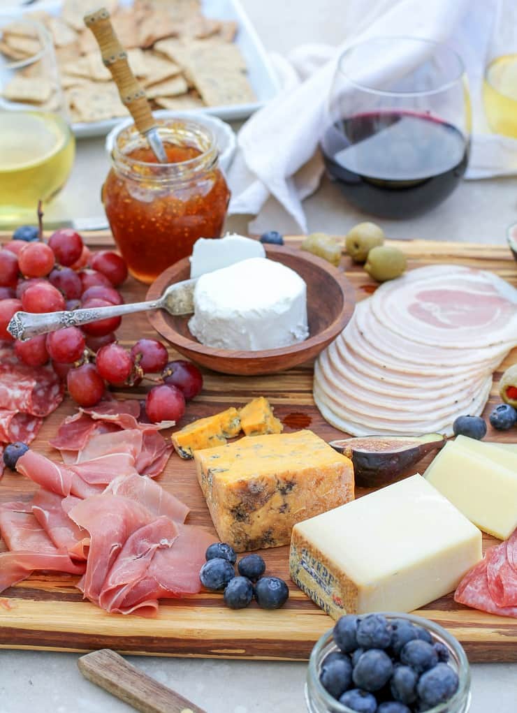 How to Make a Charcuterie Board - tips for selecting meat, wine and cheese pairings, as well as incorporating seasonal ingredients