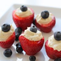 Vegan "Cheesecake" Stuffed Strawberries - naturally sweetened and healthy! | theroastedroot.net #vegan #paleo #dessert Make these treats for the 4th of July!