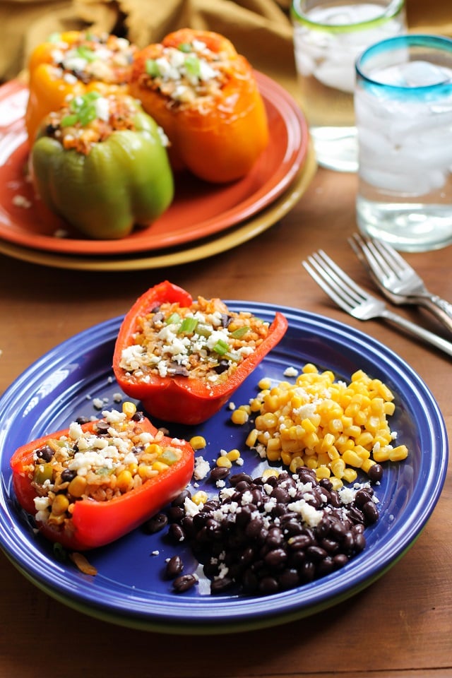 Southwest Stuffed Bell Peppers - an easy recipe for your weeknight meals! | TheRoastedRoot.net #vegetarian #healthy #dinner