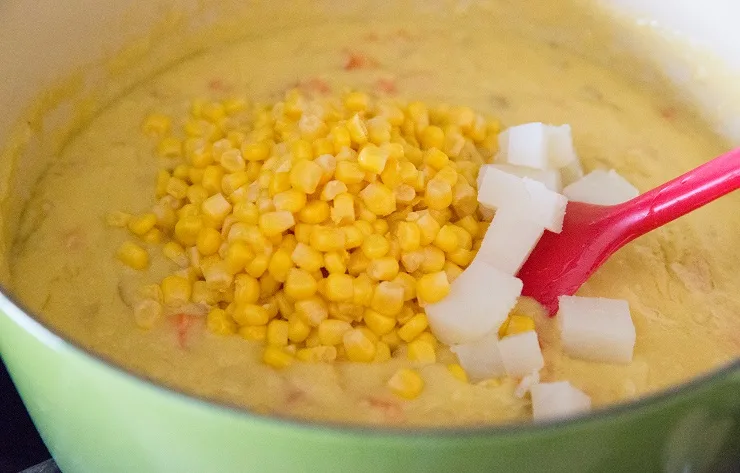 Add the rest of the corn and potatoes along with the chowder mixture to the pot