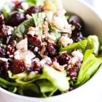 Spinach Salad with sunflower seeds, dried cranberries, grapes, feta cheese, and raspberry vinaigrette | TheRoastedRoot.net #healthy #recipe #vegetarian