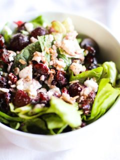 Spinach Salad with sunflower seeds, dried cranberries, grapes, feta cheese, and raspberry vinaigrette | TheRoastedRoot.net #healthy #recipe #vegetarian