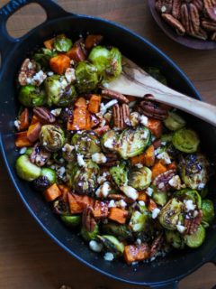 Roasted Brussels Sprouts and Sweet Potatoes with Pecans, Feta, and Balsamic Reduction | TheRoastedRoot.net #healthy #vegetarian