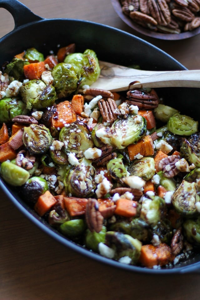 Roasted Brussels Sprouts and Sweet Potatoes with Pecans, Feta, and Balsamic Reduction | TheRoastedRoot.net #healthy #vegetarian