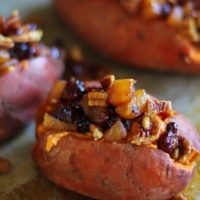 Stuffed Sweet Potatoes with yogurt, caramelized pears, pecans, and dried cranberries #healthy #sidedish #recipe #holiday #Thanksgiving TheRoastedRoot.net