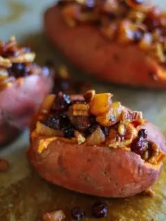 Stuffed Sweet Potatoes with yogurt, caramelized pears, pecans, and dried cranberries #healthy #sidedish #recipe #holiday #Thanksgiving TheRoastedRoot.net
