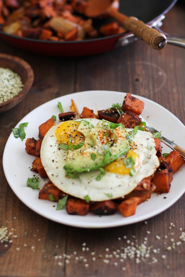 plate of sweet potato home fries with skillet in the background 