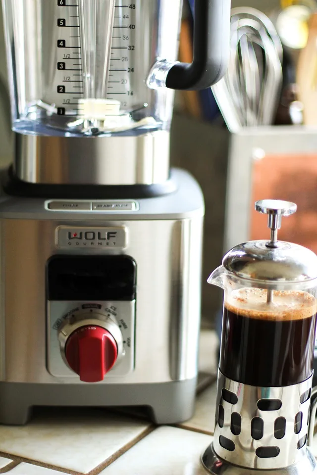 Bulletproof Coffee - brewed coffee + grassfed butter + coconut oil blended together in a blender makes a frothy latte! | TheRoastedRoot.net #paleo #recipe #healthy #drink