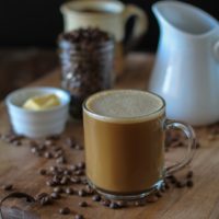 Bulletproof Coffee - brewed coffee + grassfed butter + coconut oil blended together in a blender makes a frothy latte! | TheRoastedRoot.net #paleo #recipe #healthy #drink