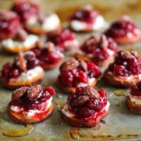 Sweet Potato Rounds with Goat Cheese, Roasted Cranberries, @bluediamond almonds, and honey TheRoastedRoot.net #healthy #appetizer