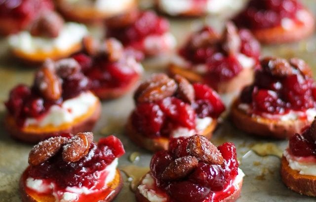Sweet Potato Rounds with Goat Cheese, Roasted Cranberries, @bluediamond almonds, and honey TheRoastedRoot.net #healthy #appetizer