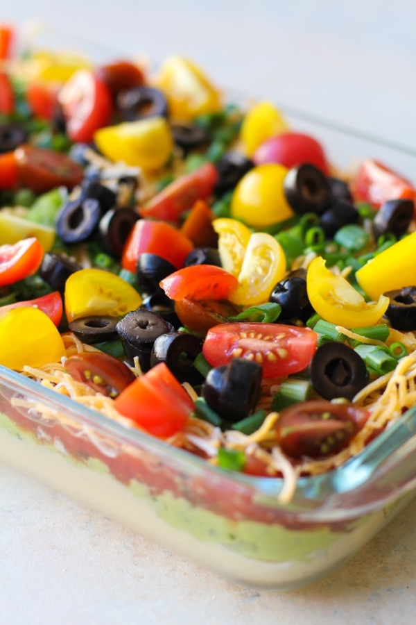7-Layer Hummus Dip with @sabradippingco hummus | TheRoastedRoot.net #healthy #ad #superbowl