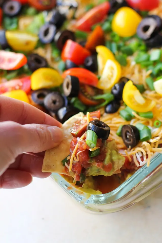 Healthy 7-Layer Hummus Dip with @sabradippingco hummus | TheRoastedRoot.net #healthy #ad #superbowl