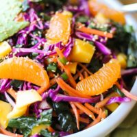 Crunchy Kale and Mandarin Salad with Avocado, Mango, and Lemon Poppy Seed Dressing | TheRoastedRoot.net #superfood #vegan #recipe #paleo