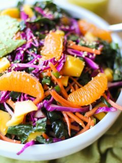 Crunchy Kale and Mandarin Salad with Avocado, Mango, and Lemon Poppy Seed Dressing | TheRoastedRoot.net #superfood #vegan #recipe #paleo