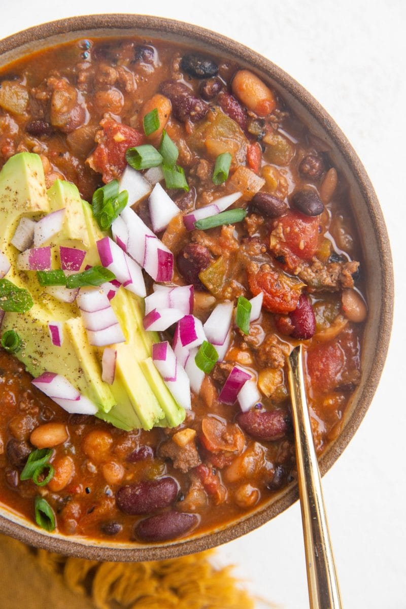 Close up top down photo of a big bowl of healthy turkey chili