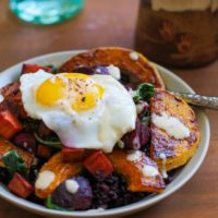 Roasted butternut squash, beet, and sweet potato forbidden rice bowls with maple tahini sauce | TheRoastedRoot.net #healthy #recipe #vegetarian