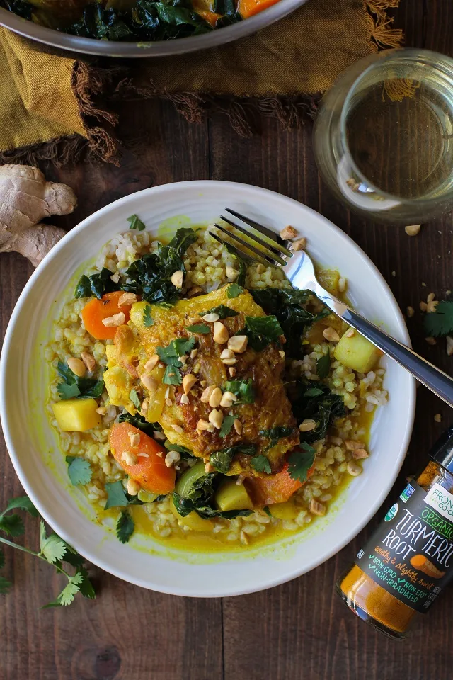 Ginger and Turmeric Braised Chicken with turnips, kale, and carrots in coconut milk broth | TheRoastedRoot.net #healthy #dinner #recipe
