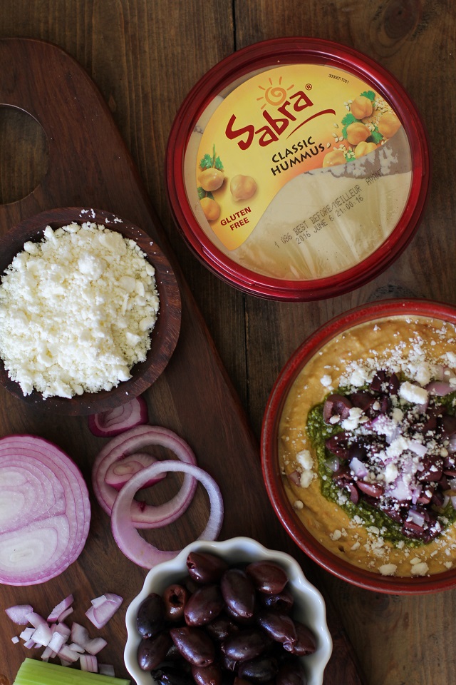 Mediterranean Hummus with Pesto and Feta | TheRoastedRoot.net #appetizer #healthy #recipe