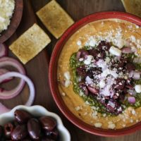 Mediterranean Hummus with Pesto and Feta | TheRoastedRoot.net #appetizer #healthy #recipe