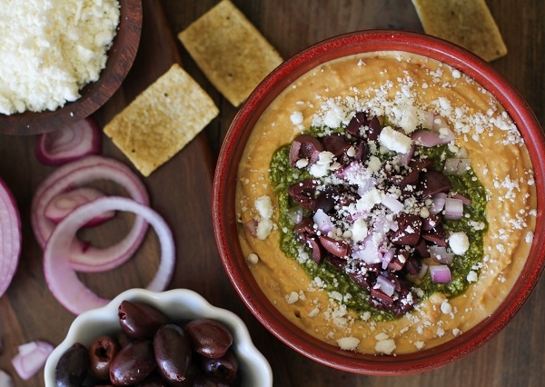 Mediterranean Hummus with Pesto and Feta | TheRoastedRoot.net #appetizer #healthy #recipe