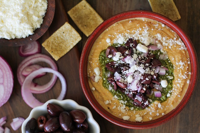 Mediterranean Hummus with Pesto and Feta | TheRoastedRoot.net #appetizer #healthy #recipe 