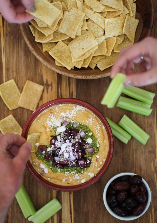 Mediterranean Hummus with Pesto and Feta | TheRoastedRoot.net #appetizer #healthy #recipe