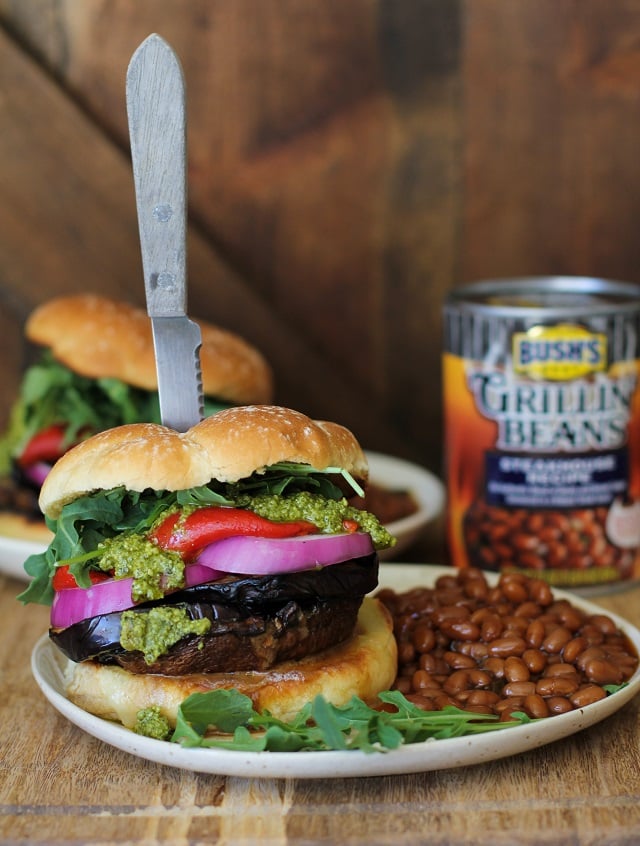 The Ultimate Grilled Portobello Burger with grilled eggplant, roasted red peppers, red onion, arugula, and pesto sauce | TheRoastedRoot.net #healthy #vegetarian #recipe