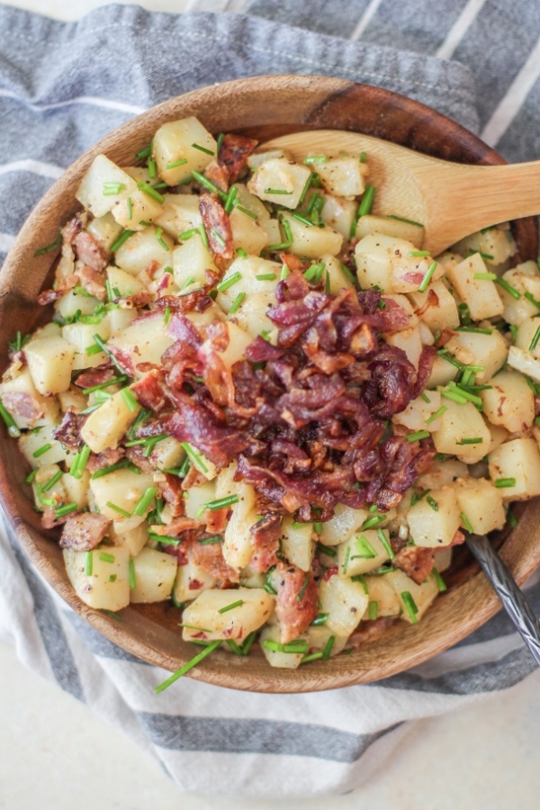 German-Style Potato Salad with bacon, caramelized onions, and chives | TheRoastedRoot.net #sidedish #recipe #picnic #bbq #summer #4thofjuly
