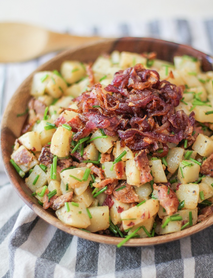 German-Style Potato Salad with bacon, caramelized onions, and chives | TheRoastedRoot.net #sidedish #recipe #picnic #bbq #summer #4thofjuly