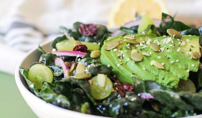 Lemon Basil Kale Salad with grapes, pumpkin seeds, and avocado | TheRoastedRoot.net #healthy #salad #recipe #detox #vegan #vegetarian