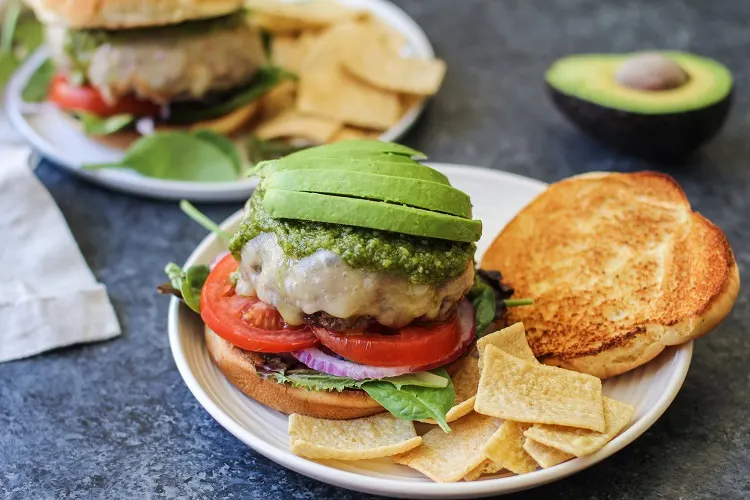 Skillet-Cooked Bison Burgers with Havarti Cheese and Pesto Sauce | TheRoastedRoot.net #recipe #burger #dinner