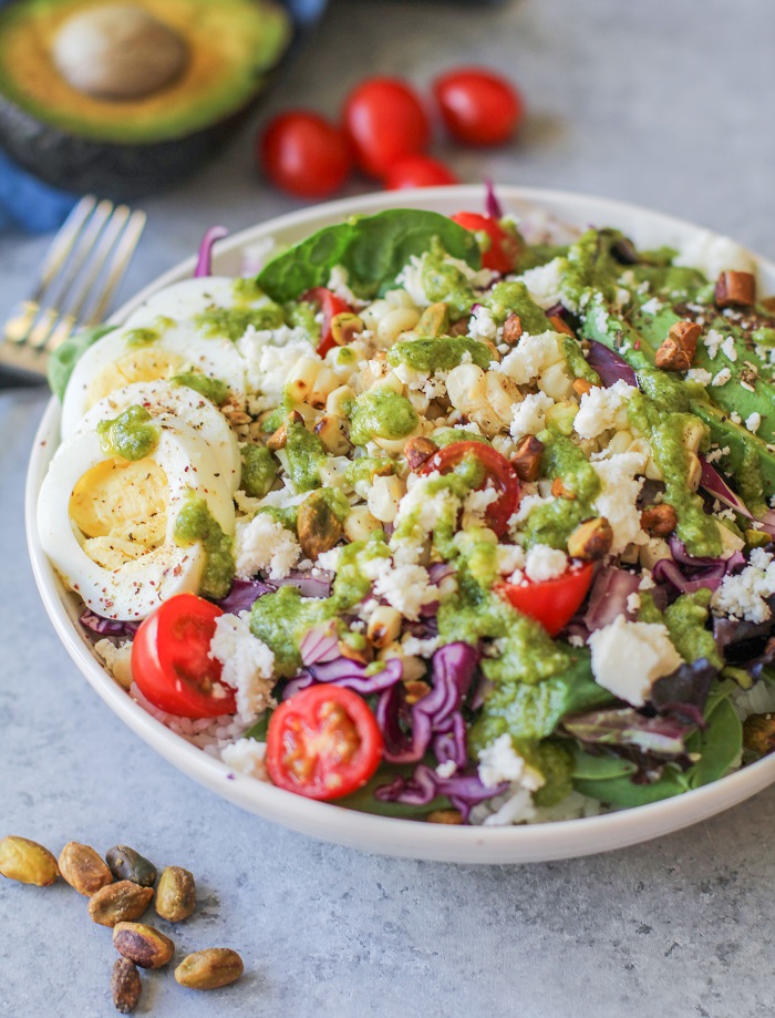 Mexican Street Corn Buddha Bowls with fresh veggies, hard boiled egg, queso fresco, and basil-lime vinaigrette | TheRoastedRoot.net #vegetarian #dinner #recipe #healthy