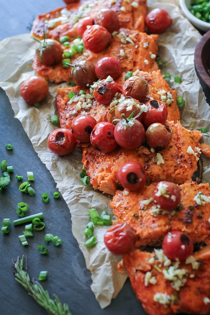 Roasted Salmon with Rosemary Lemon Garlic Butter Sauce and Blistered Tomatoes | TheRoastedRoot.net #healthy #glutenfree #dinner #recipe #copperriversalmon