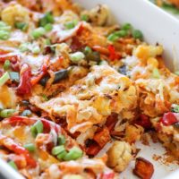 Roasted Vegetable Stacked Enchiladas in a large casserole dish.