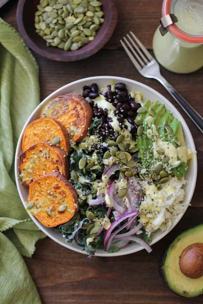 Roasted Sweet Potato and Cauliflower Rice Buddha Bowls with Turmeric Tahini Dressing | TheRoastedRoot.net #healthy #recipe #vegan #vegetarian